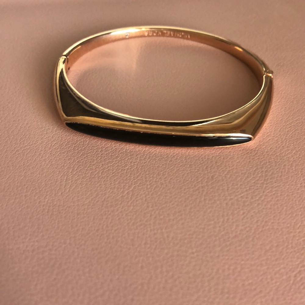 Micheal Kors gold with black bracelet
